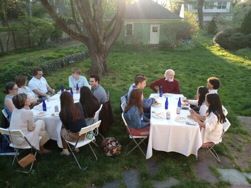 people sitting at tables outside.