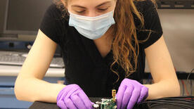 Wright Lab graduate student Samantha Pagan works on muon veto system taggers. Photo by Iris Ponce.